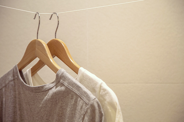 T-shirts on hangers in closet