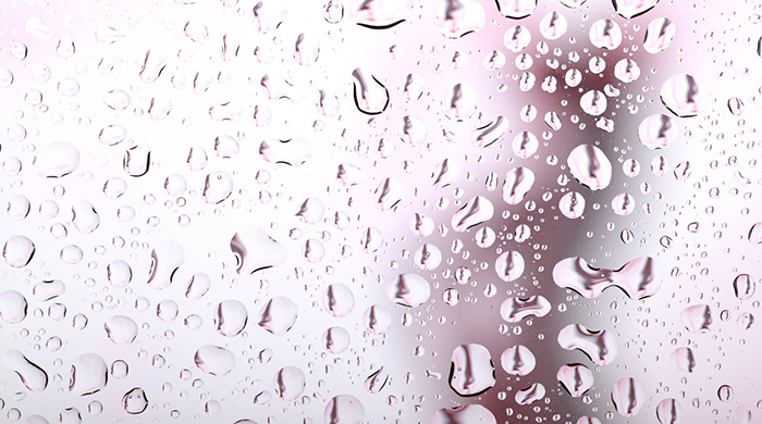 Woman taking a Shower, water droplets on shower doors