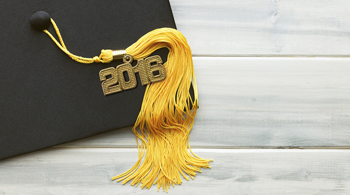 Black mortar board hat and gold tassel for graduation