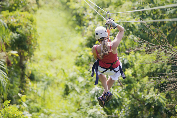 Woman on zipline in the forest