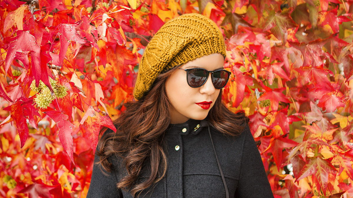girl wearing a beanie and sunglasses