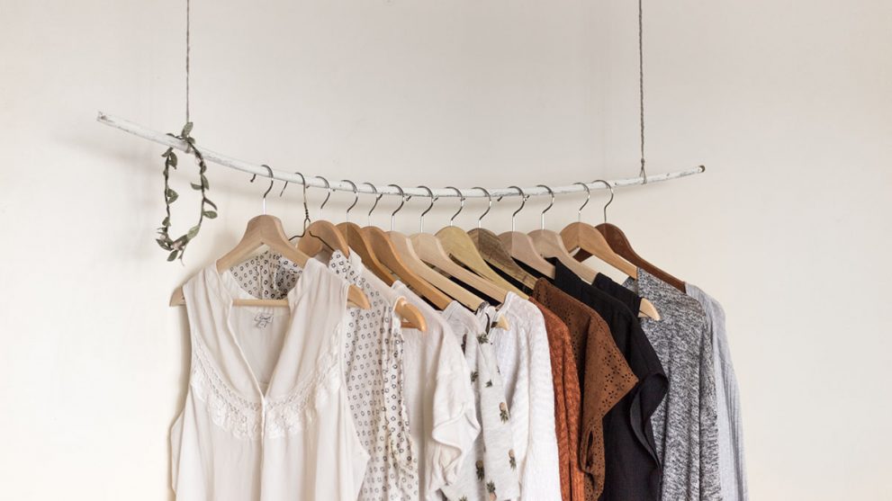 Clothes hanging on a wooden rack