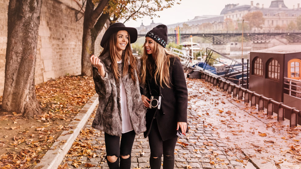 Two fashion girls walking together