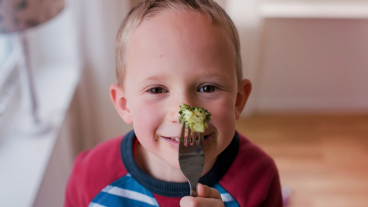 Boy with broccoli