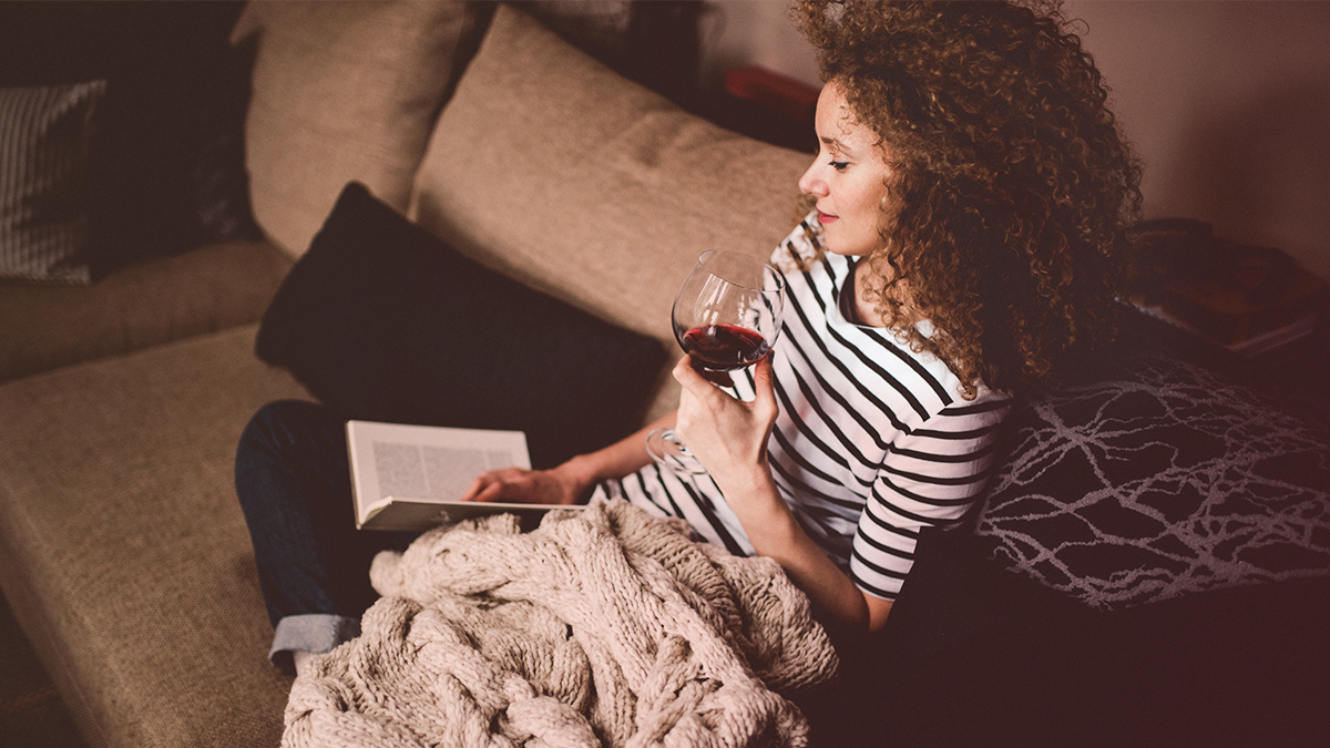 Girl with wine and a book